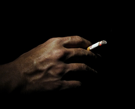 hand holding a cigarette